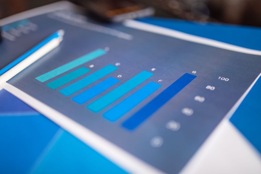 Detailed close-up of a blue bar graph showing data analysis on printed paper.